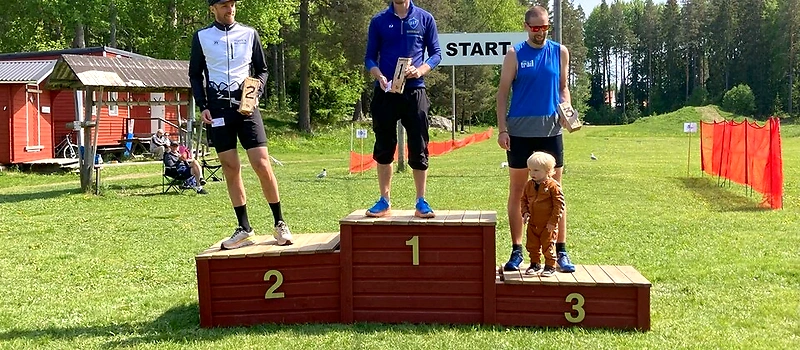Runners on the podium after a race.