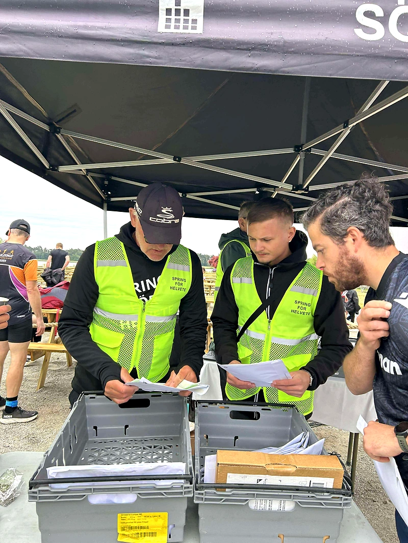 Competition officials organize materials at the Killebom Race Sölvesborg.
