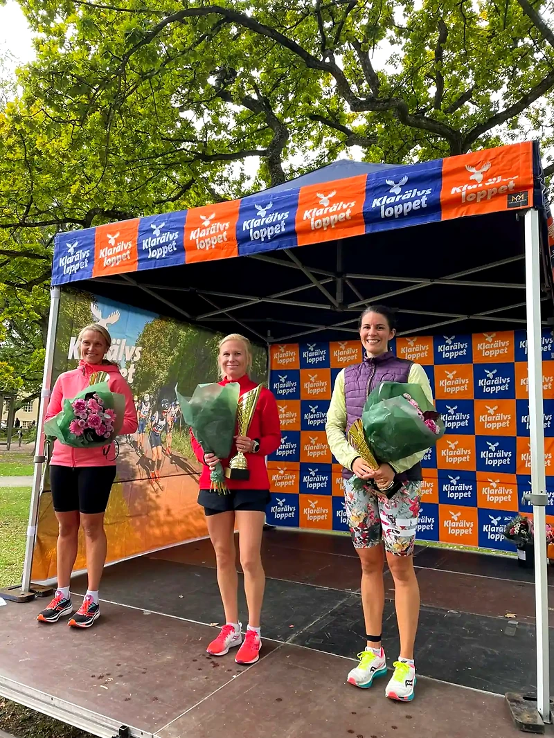 Klarälvsloppet podium with winners and logo.