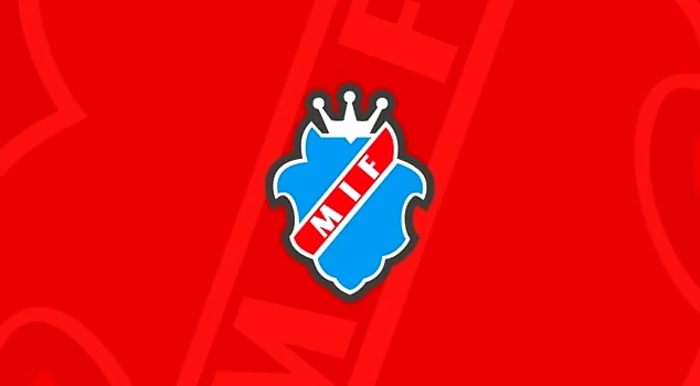 Månkarbo IF-logotyp med blå sköld och krona på röd bakgrund.