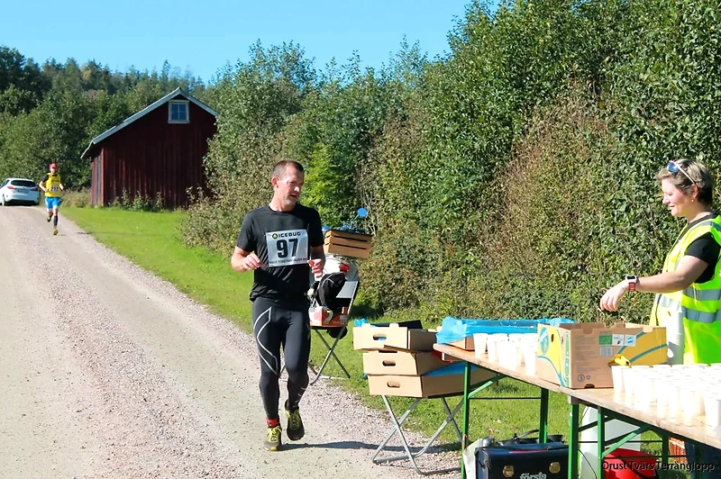 Runners in cross-country races with hydration control.