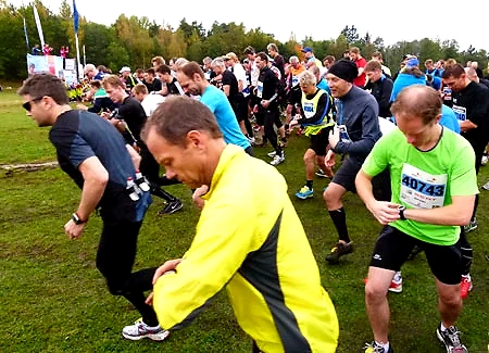 Runners at the starting line before a cross-country race.