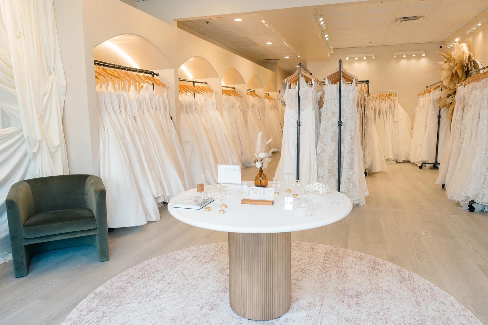 Cozy bridal boutique showroom with elegant designer gowns