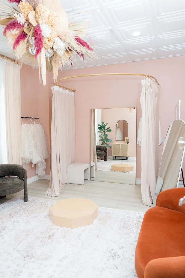 Private bridal suite with mimosas and luxury wedding gowns
