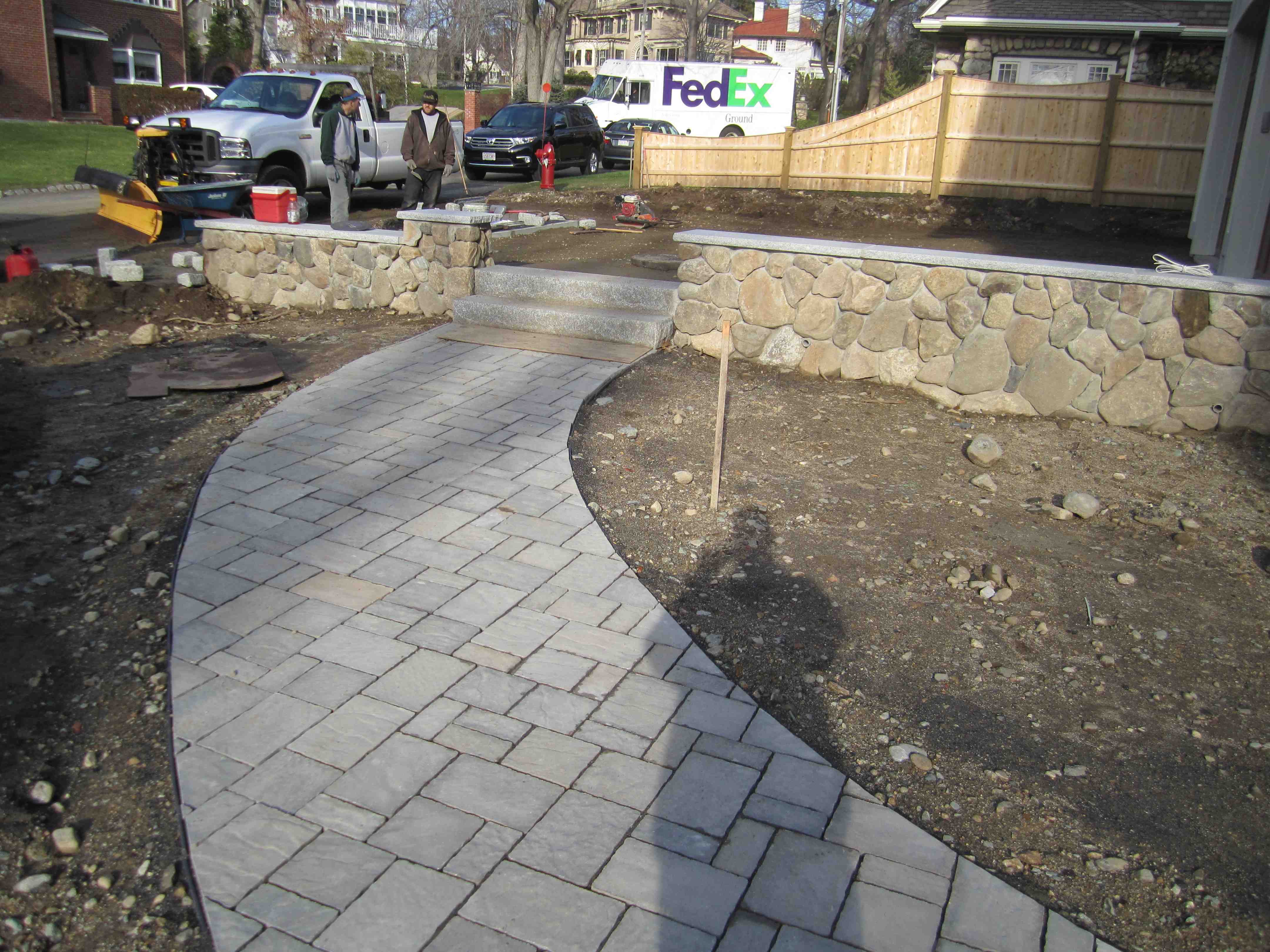 Hardscape elements like walkways and retaining walls - commercial landscape design