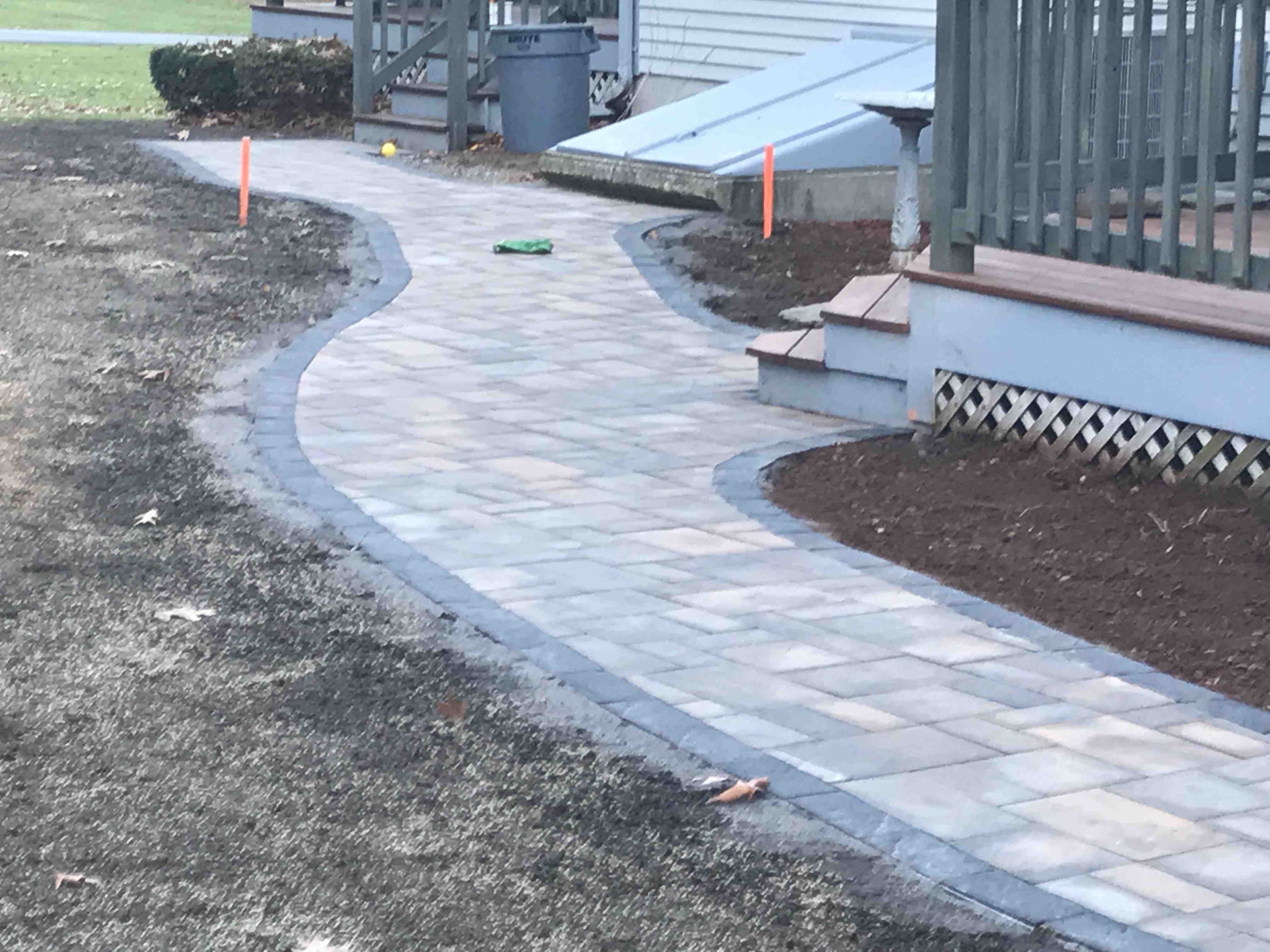 Outdoor garden with a mix of stone walkway and plants - hardscape and landscape