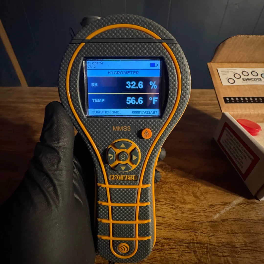 Professional technician creating a digital moisture map on a tablet - moisture mapping mold prevention