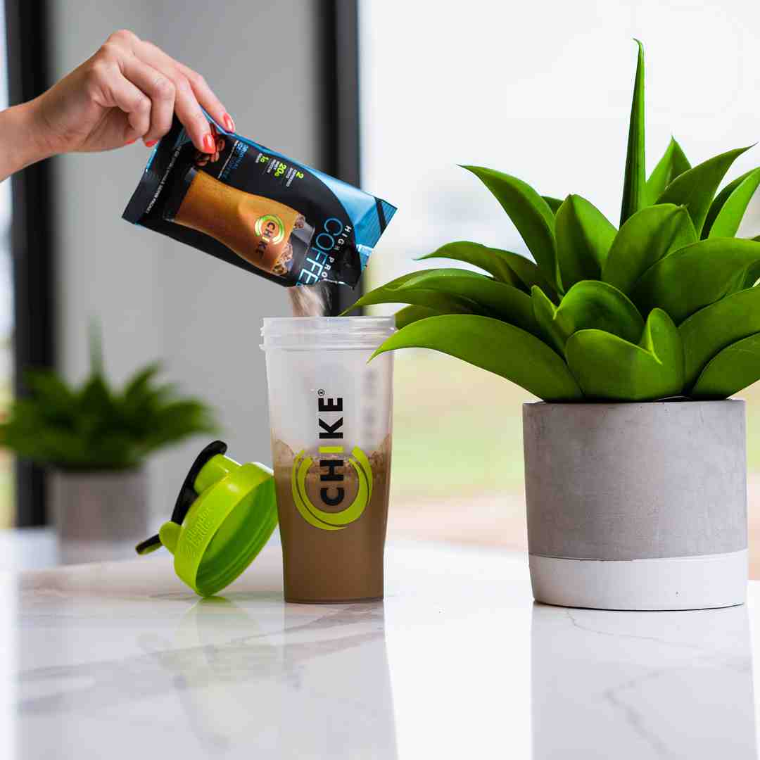 protein coffee smoothie being made in blender - coffee for muscle recovery