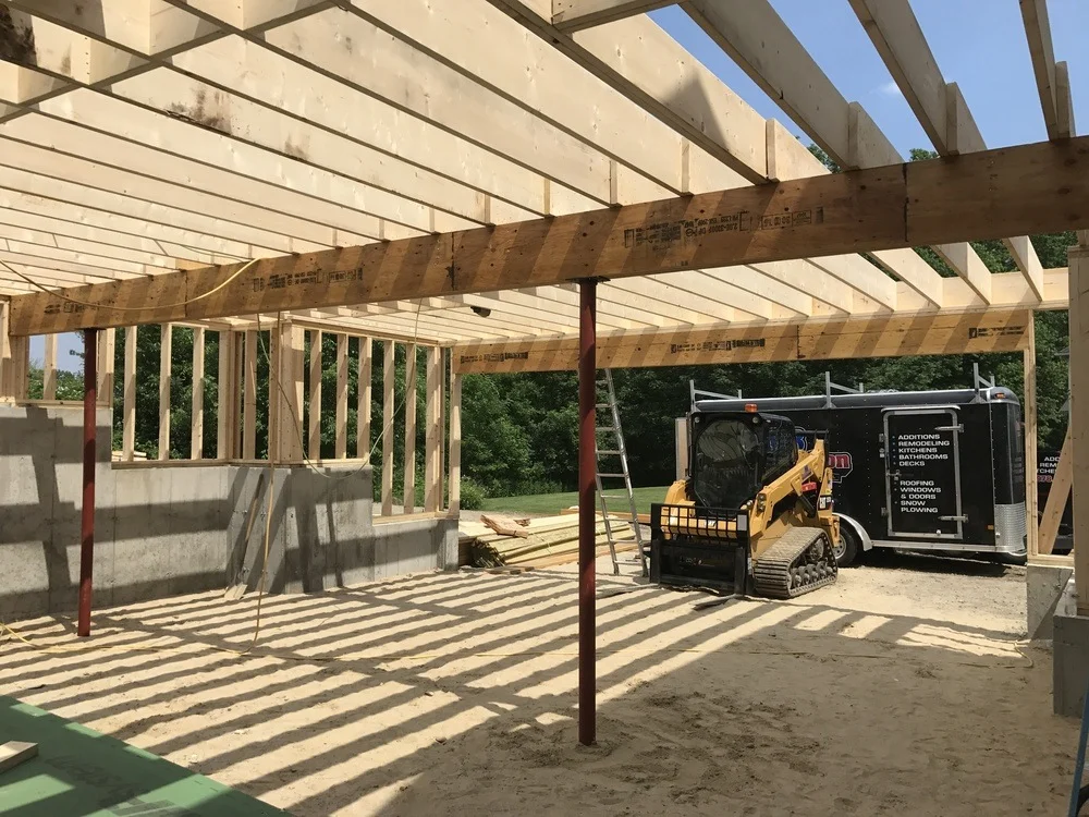 Structural engineer inspecting a home foundation - house addition cost