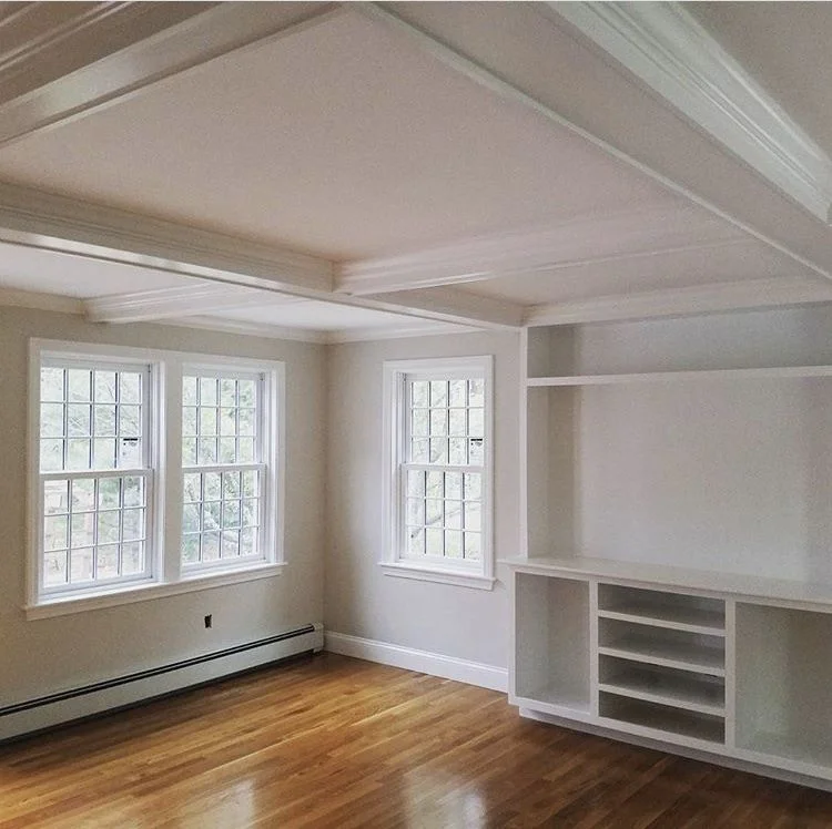 A bright attic bedroom created by a dormer addition showing increased headroom and natural light - adding a dormer to a A bright attic bedroom created by a dormer addition showing increased headroom and natural light - adding a dormer to a