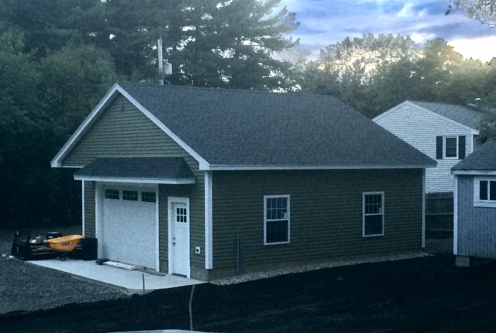 A detached garage with a functional loft and matching siding - 2 story garage additions