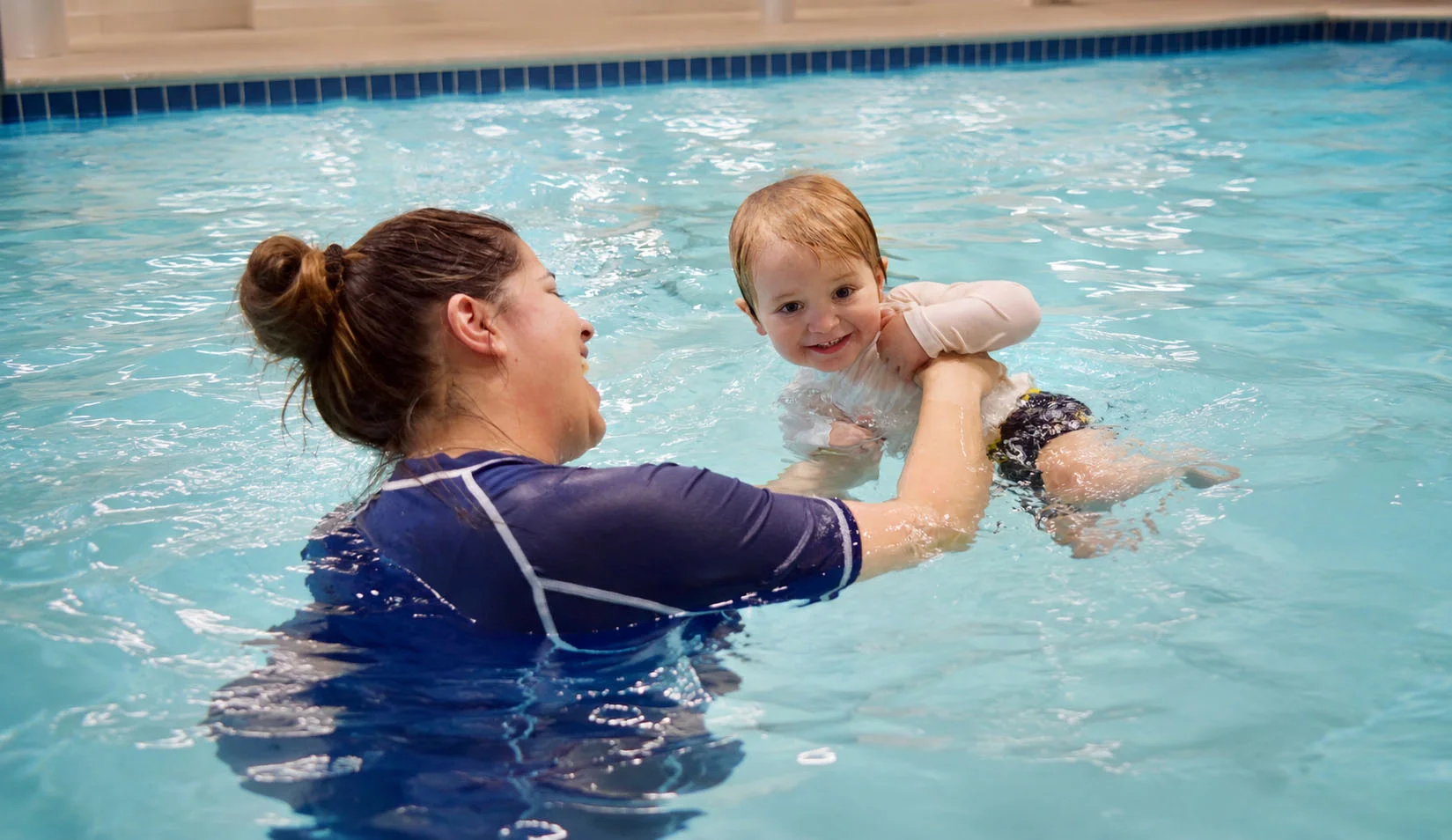 toddler practicing back floating with assistance toddler practicing back floating with assistance