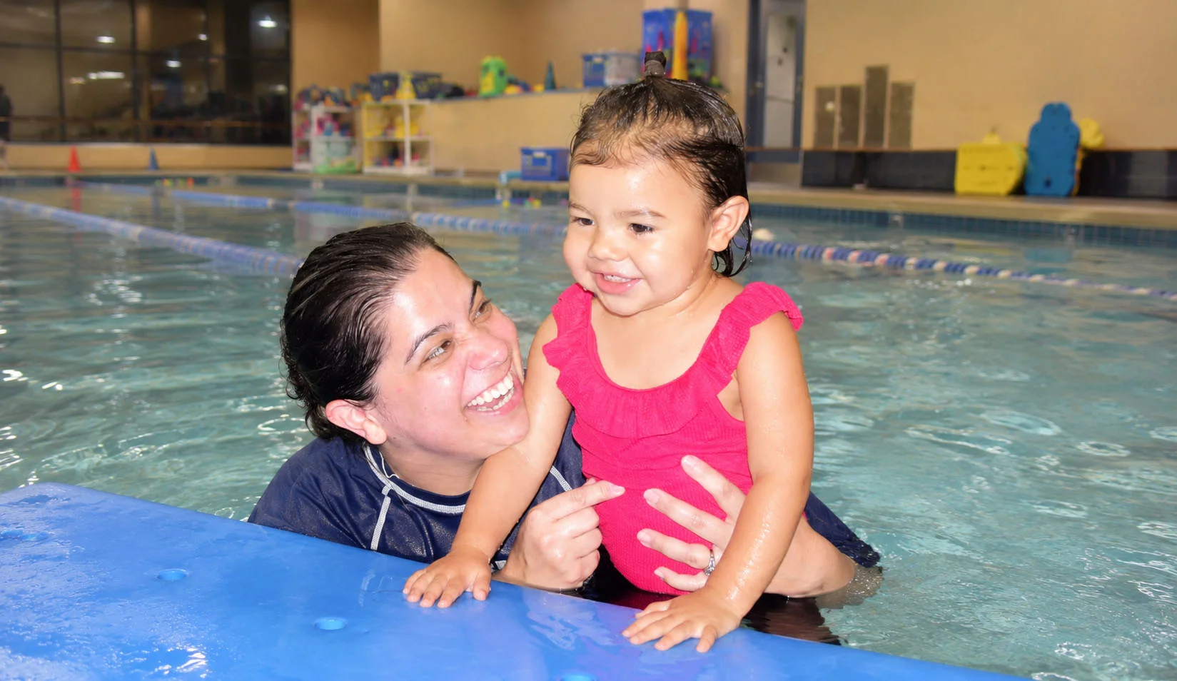 dublin swim lessons for beginners toddler splashing happily with instructor dublin swim lessons for beginners toddler splashing happily with instructor