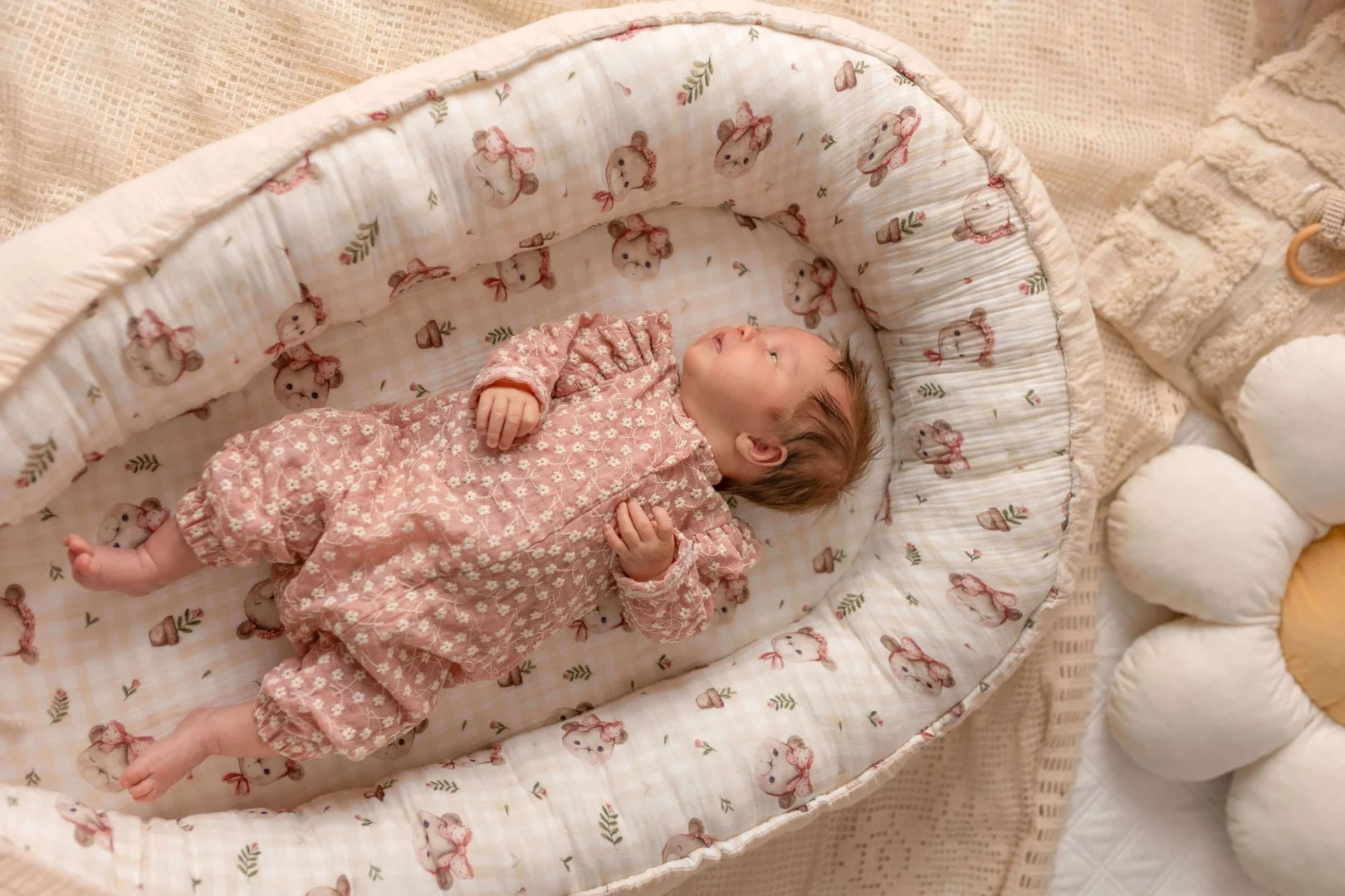 An inclined baby lounger placed on a flat floor surface