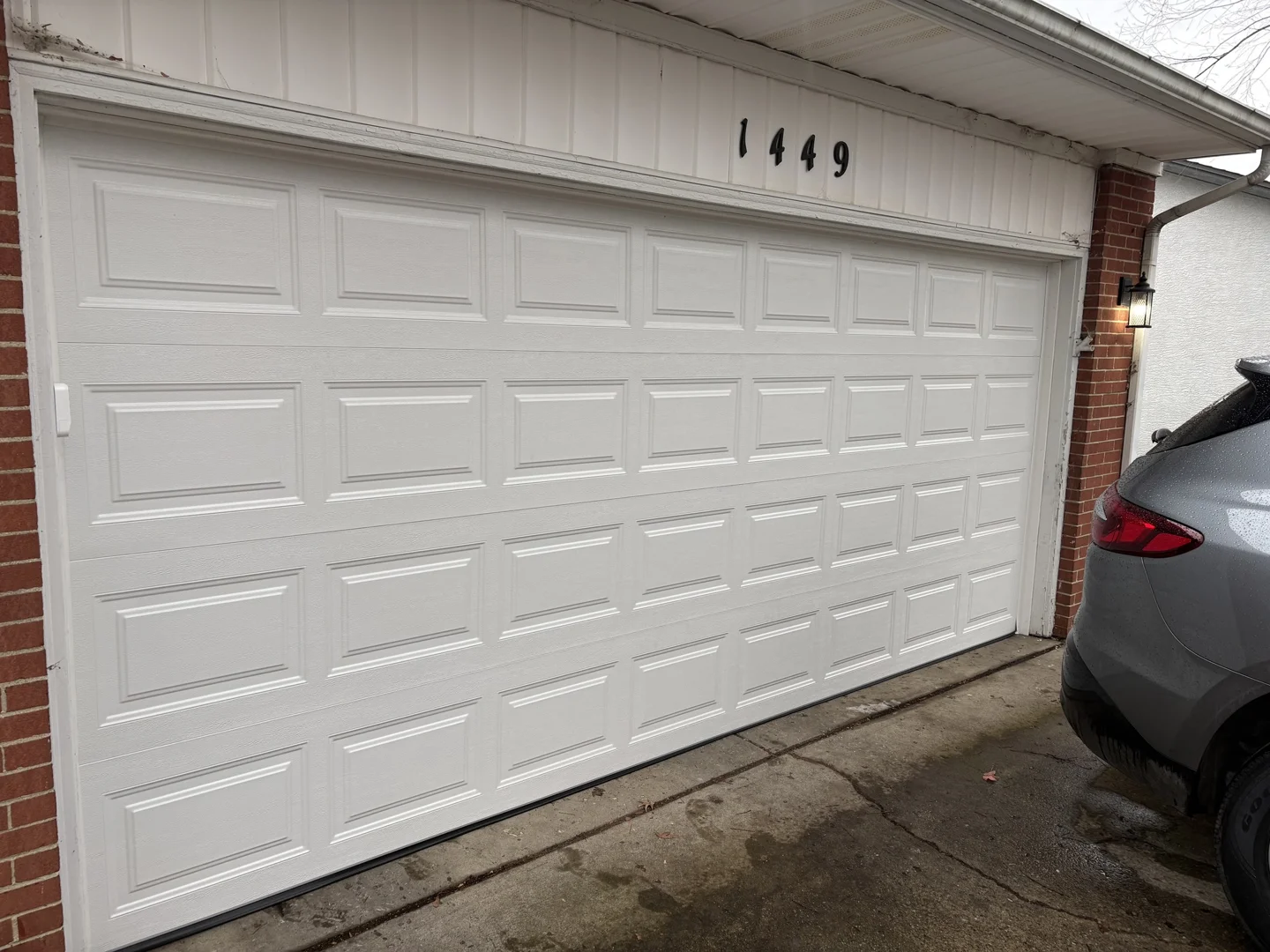 Modern, well-maintained garage door enhancing home exterior - benefits of preventative maintenance garage doors