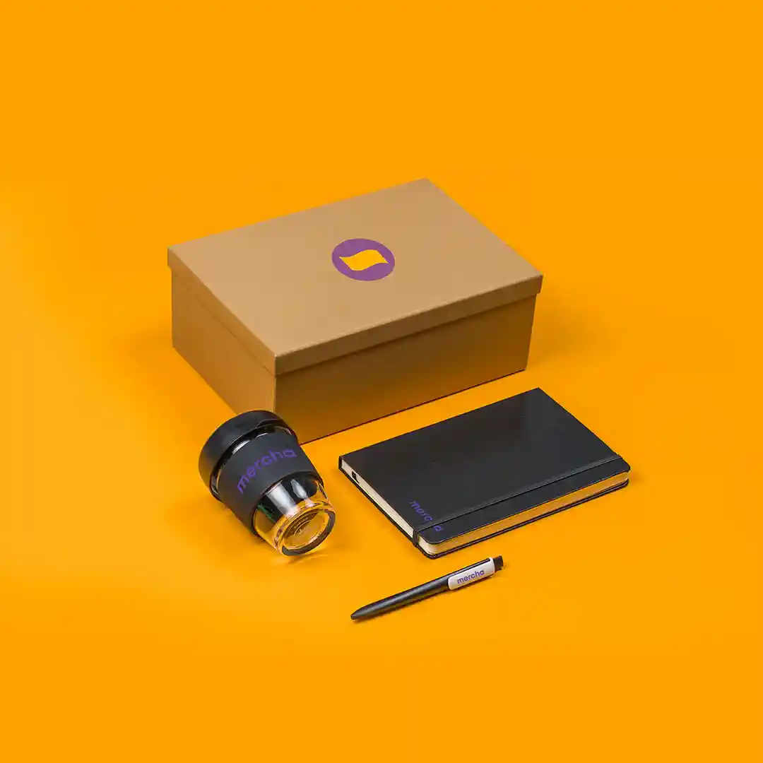 person happily receiving a custom gift box with a company logo from Mercha - business gifts with logo