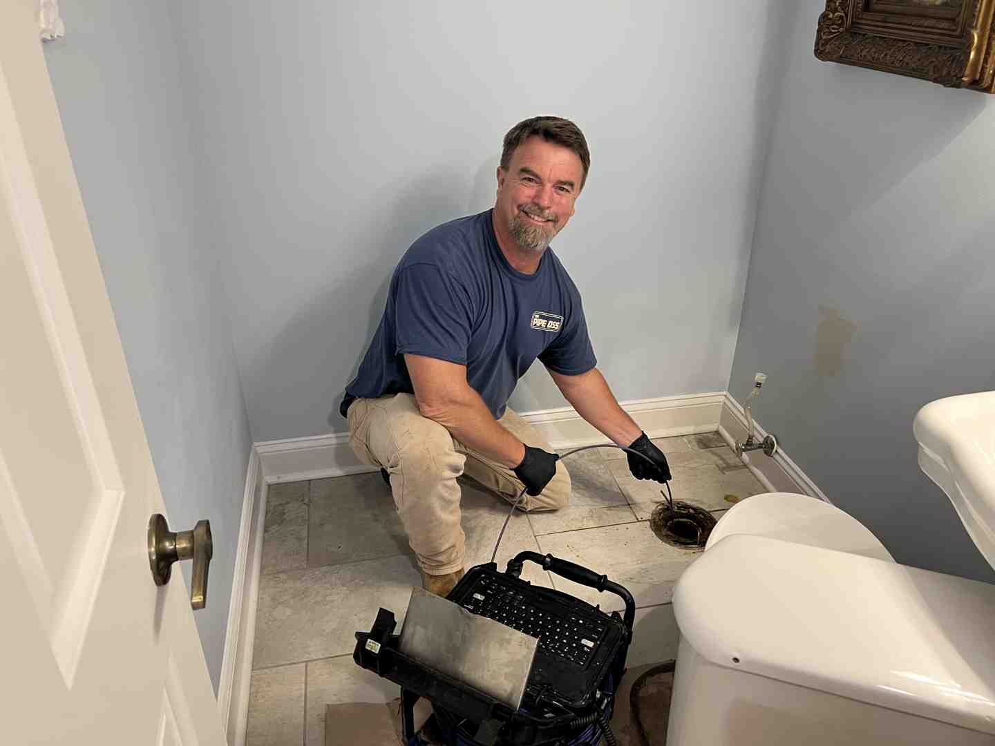 a plumber performing a sewer camera inspection on a screen - main line plumbing repair cost a plumber performing a sewer camera inspection on a screen - main line plumbing repair cost