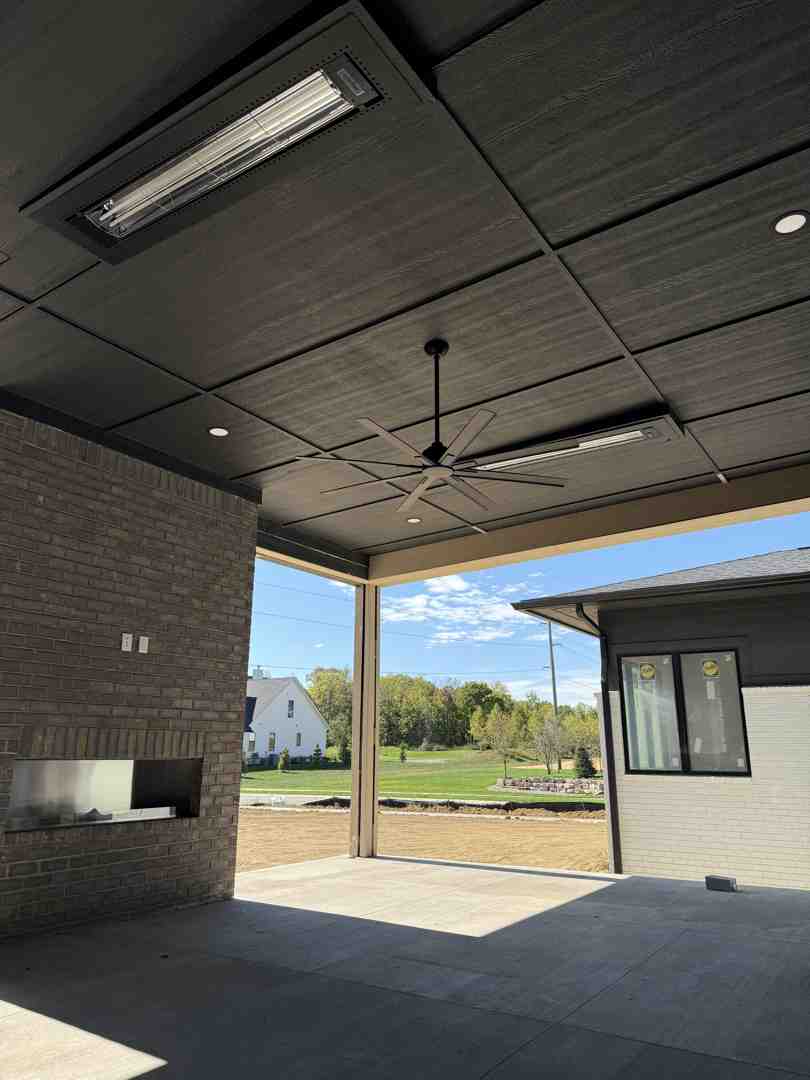 Electrician installing outdoor lighting on a residential home in Central Indiana - best outdoor lights for backyard