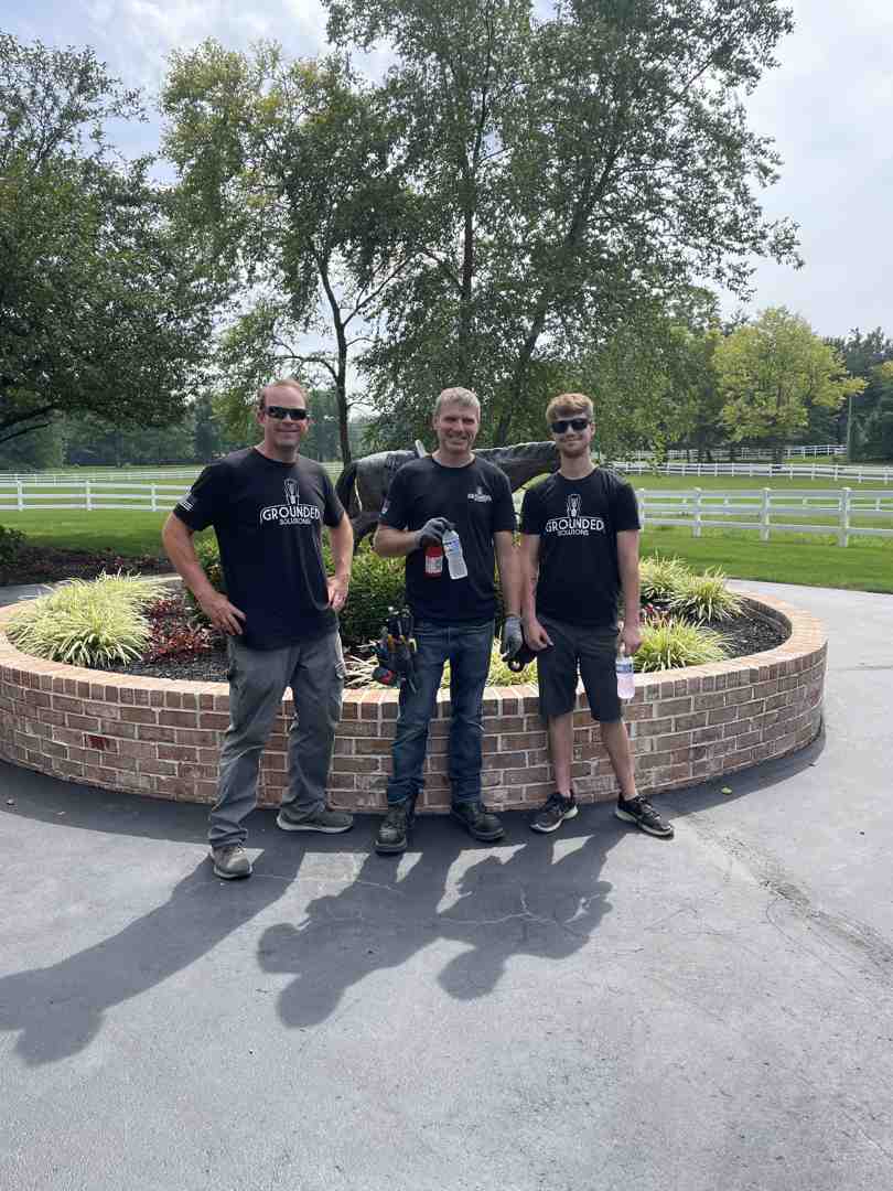 a multi-generational family of electricians standing together, smiling - family-owned electrical contractor in Indianapolis a multi-generational family of electricians standing together, smiling - family-owned electrical contractor in Indianapolis