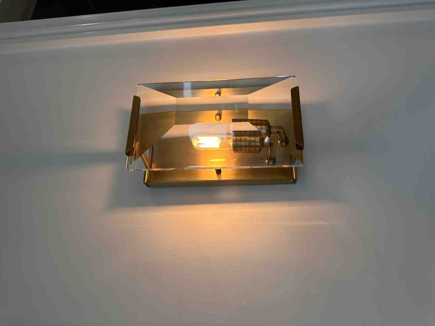 showcasing different types of ambient light fixtures like wall sconces, recessed lights, and cove lighting. - ambient light installation