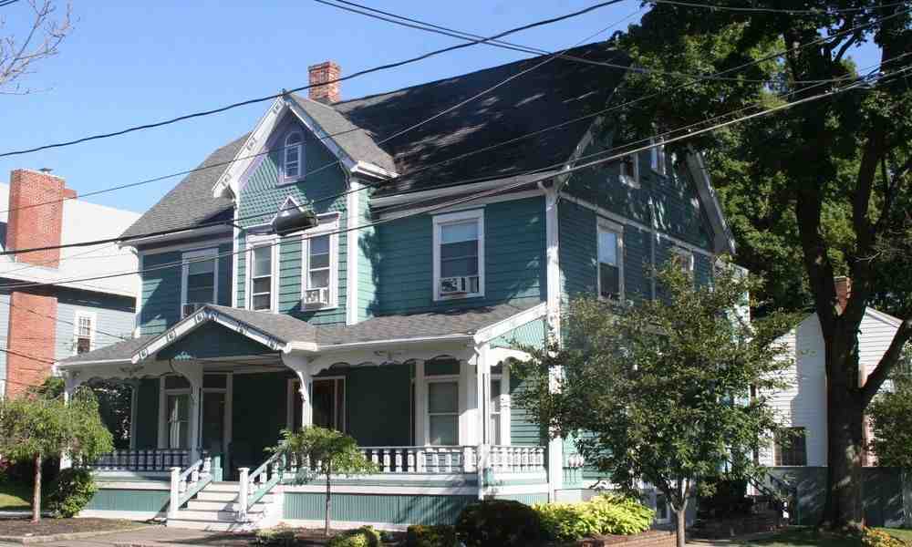 a steep, gabled residential roof showcasing its architectural lines - commercial and residential roofing a steep, gabled residential roof showcasing its architectural lines - commercial and residential roofing
