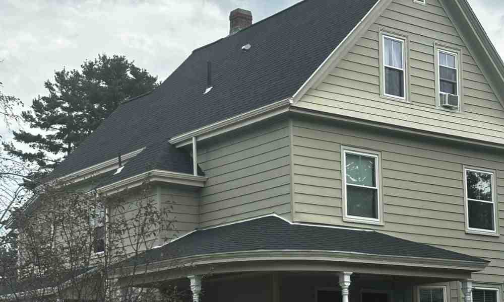 A professional roofer carefully installing high-quality asphalt shingles on a residential home - roofer contractors A professional roofer carefully installing high-quality asphalt shingles on a residential home - roofer contractors