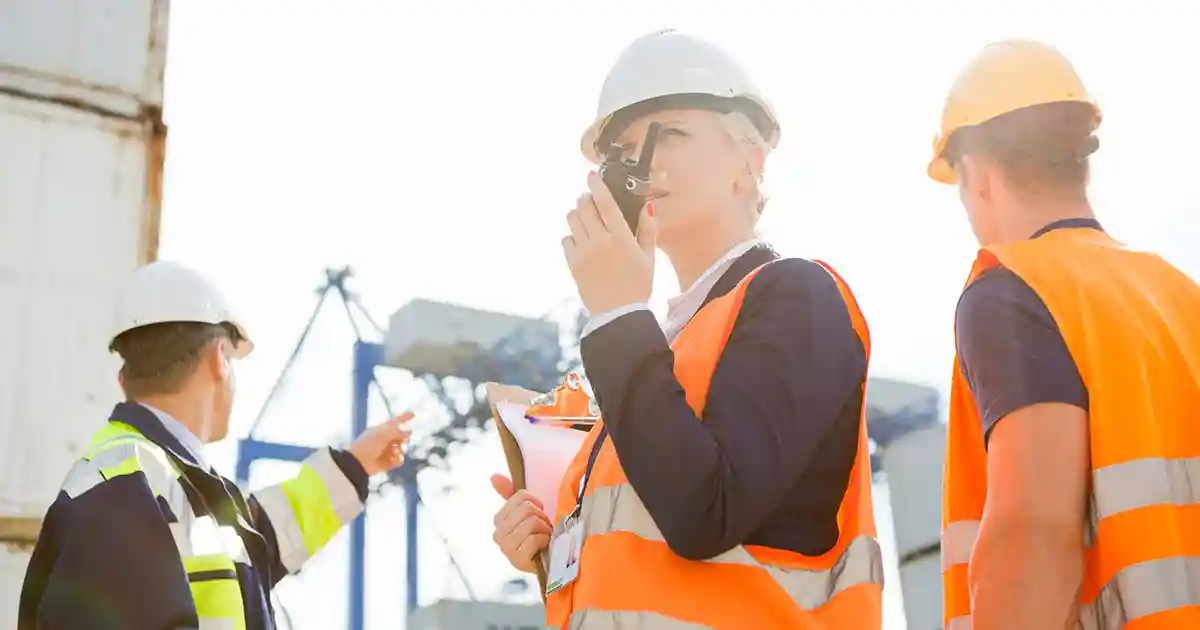 workers in industrial setting with intrinsically safe radios - intrinsically safe radios