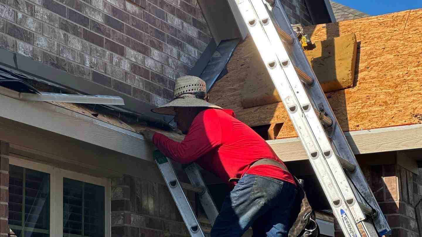 A homeowner carefully installing a new soffit vent into the underside of a roof's overhang, ensuring proper alignment and fit - Attic ventilation installation A homeowner carefully installing a new soffit vent into the underside of a roof's overhang, ensuring proper alignment and fit - Attic ventilation installation