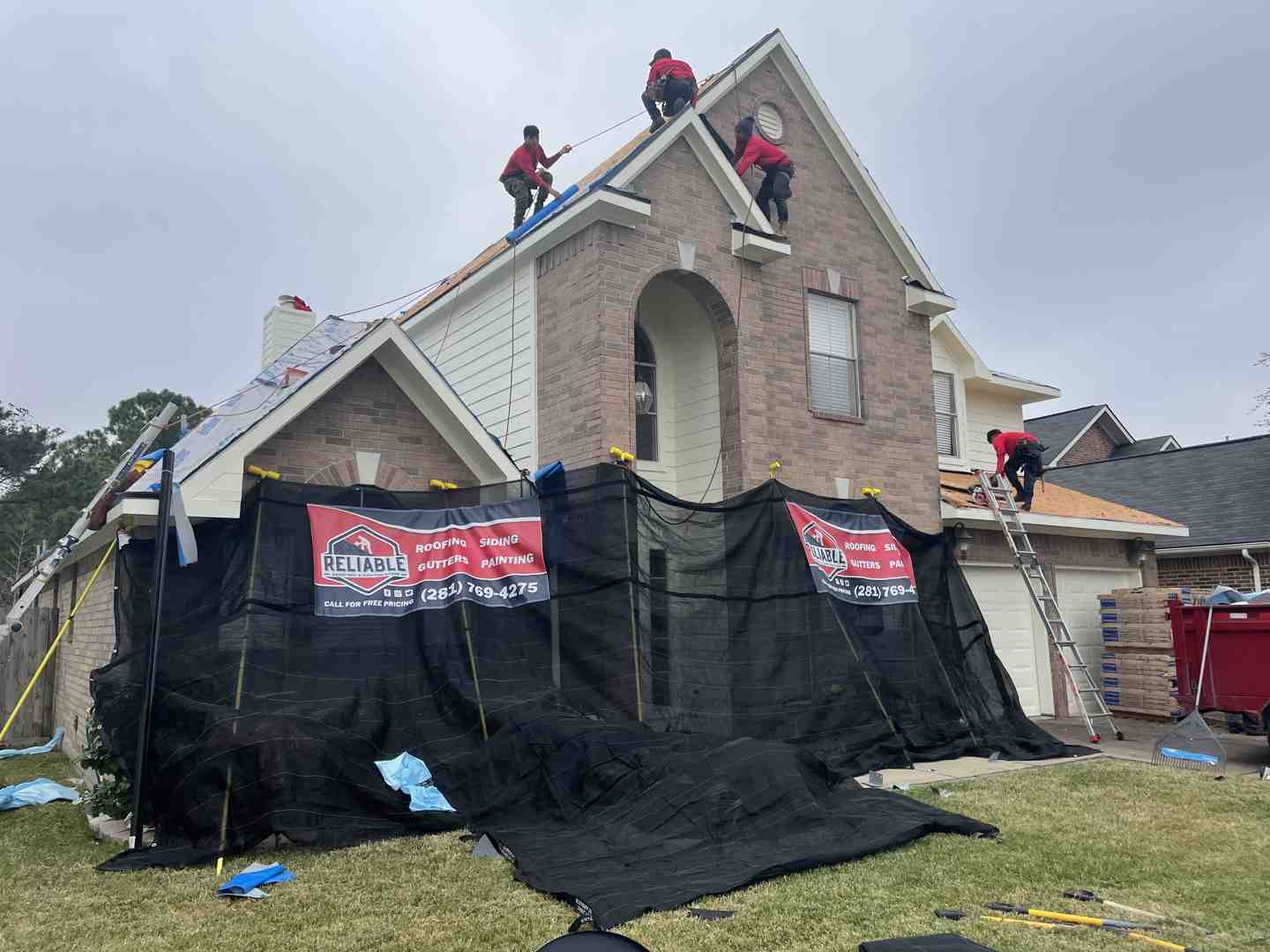 roofing crew installing shingles - affordable roof repair cypress tx