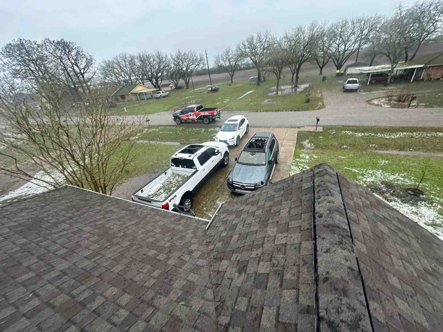 close-up of hail "bruising" on an asphalt shingle - hail damage repair tomball close-up of hail "bruising" on an asphalt shingle - hail damage repair tomball
