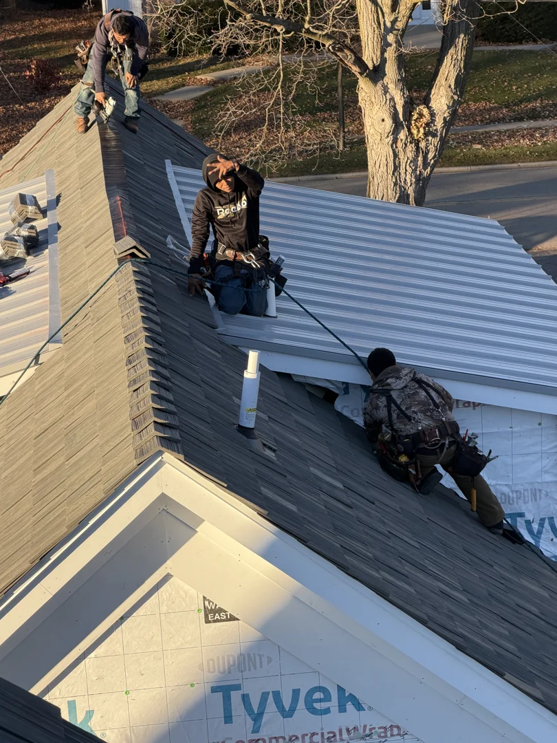 professional roof tarping being secured with wooden furring strips to prevent wind lift - emergency roof repair janesville professional roof tarping being secured with wooden furring strips to prevent wind lift - emergency roof repair janesville