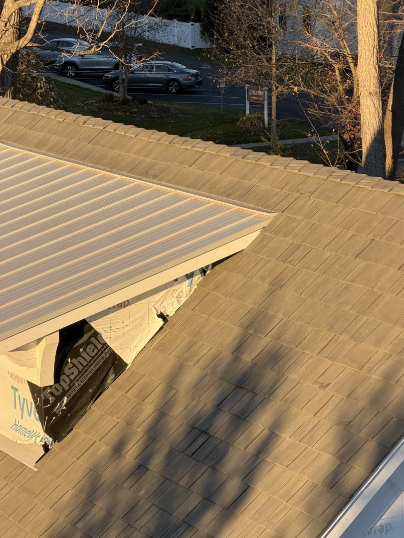 Layered roof assembly showing structural deck fastening, secondary water barrier, and impact shingles Layered roof assembly showing structural deck fastening, secondary water barrier, and impact shingles