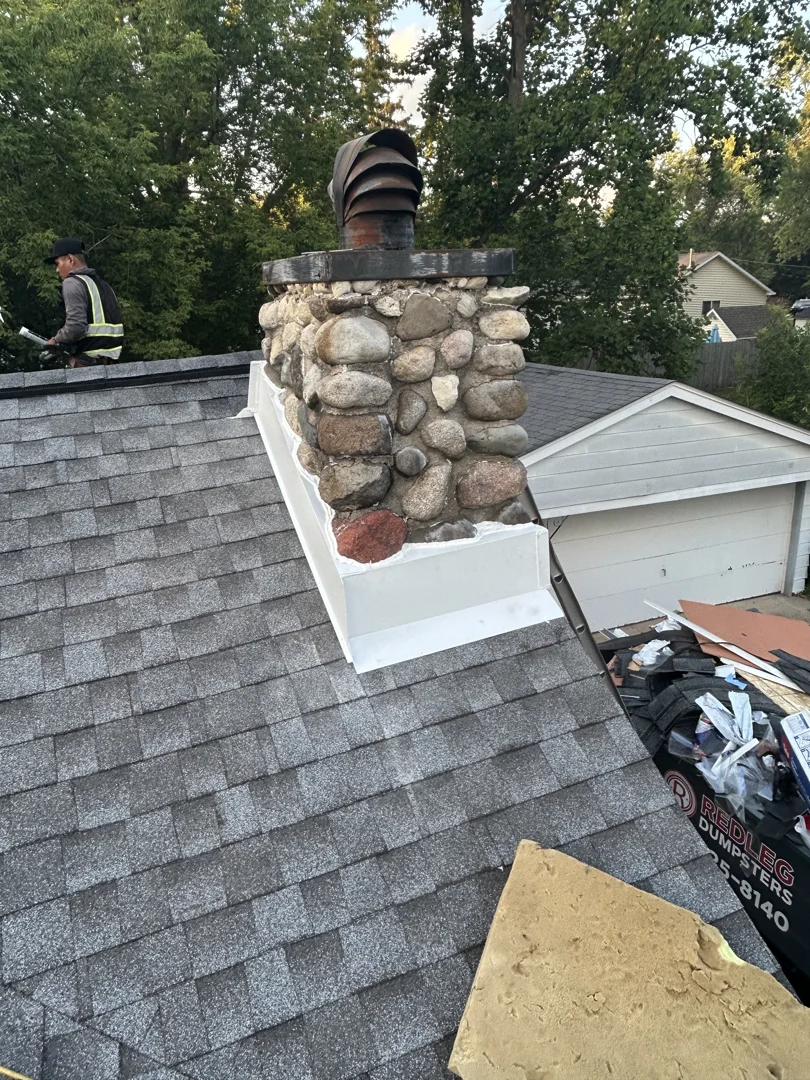 Professional roofing contractor inspecting a roof for hail damage using a chalking method to highlight dents - hail damage Professional roofing contractor inspecting a roof for hail damage using a chalking method to highlight dents - hail damage