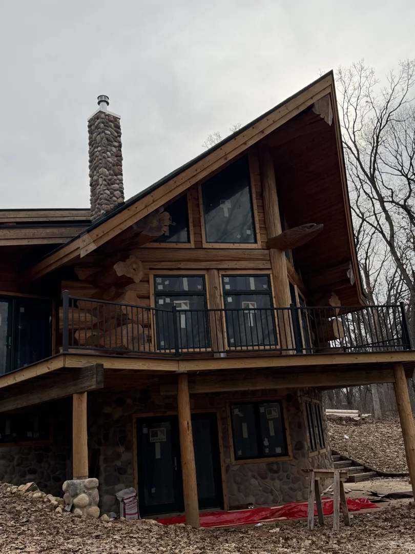 black wood home integrated into forest treeline black wood home integrated into forest treeline