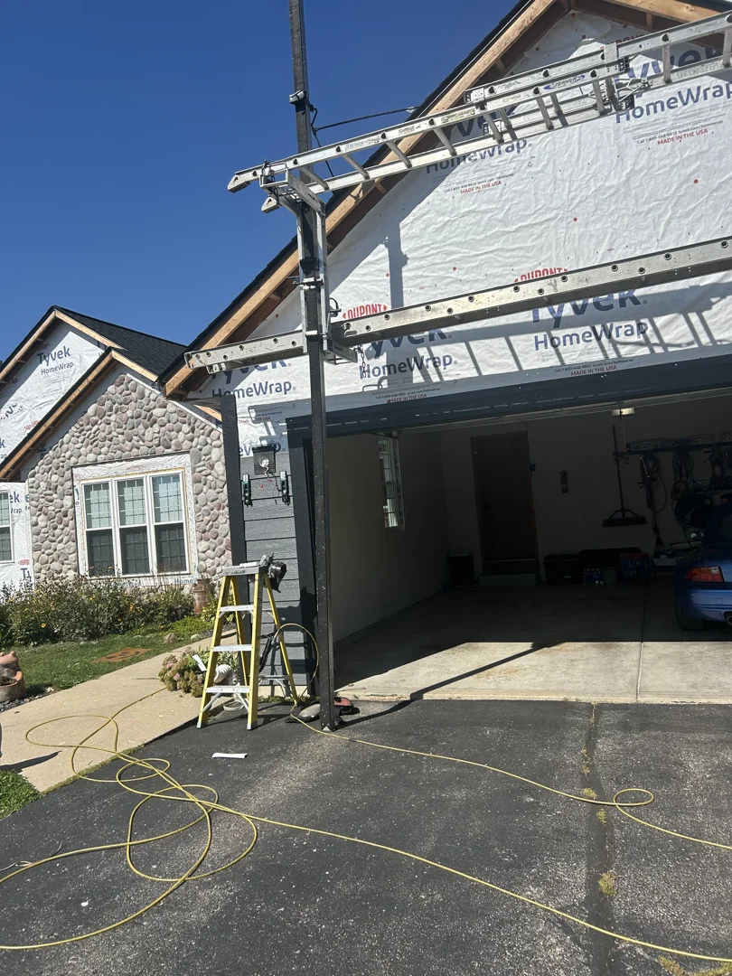 A home exterior prepared for construction with protective landscaping wrap A home exterior prepared for construction with protective landscaping wrap