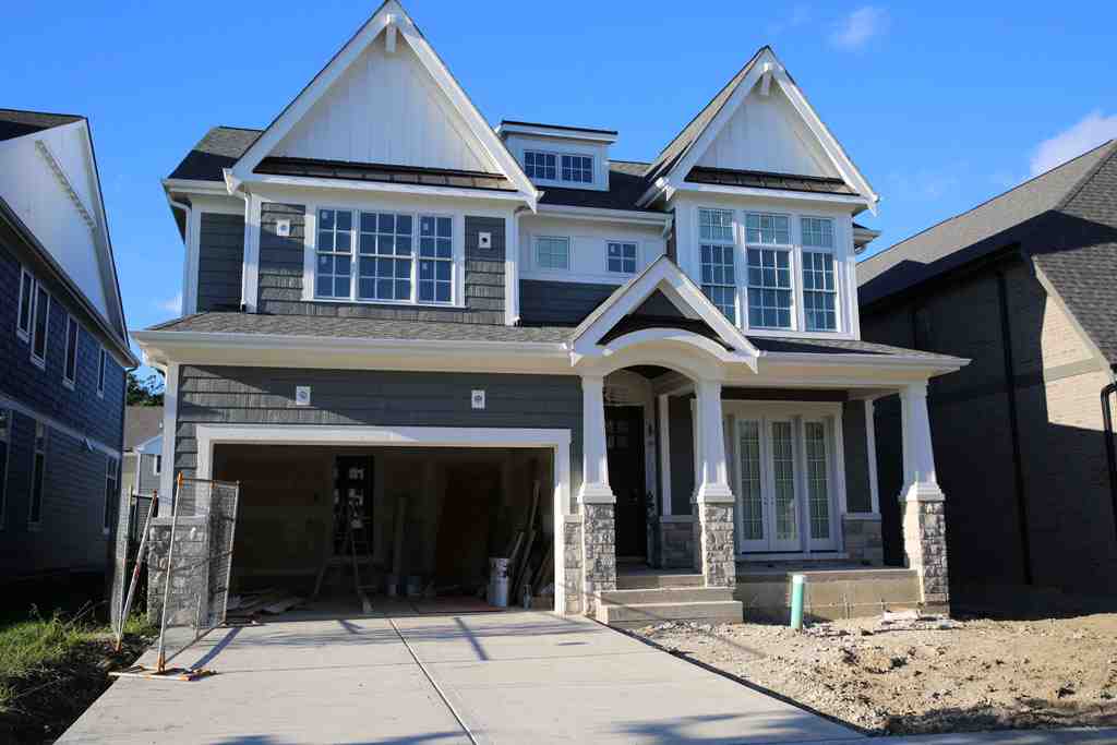 Craftsman style wood entry door with sidelights
