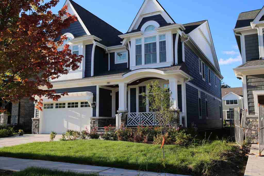 two-story home undergoing siding replacement chicago suburb
