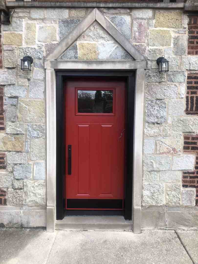 Craftsman style entry door with decorative glass sidelights