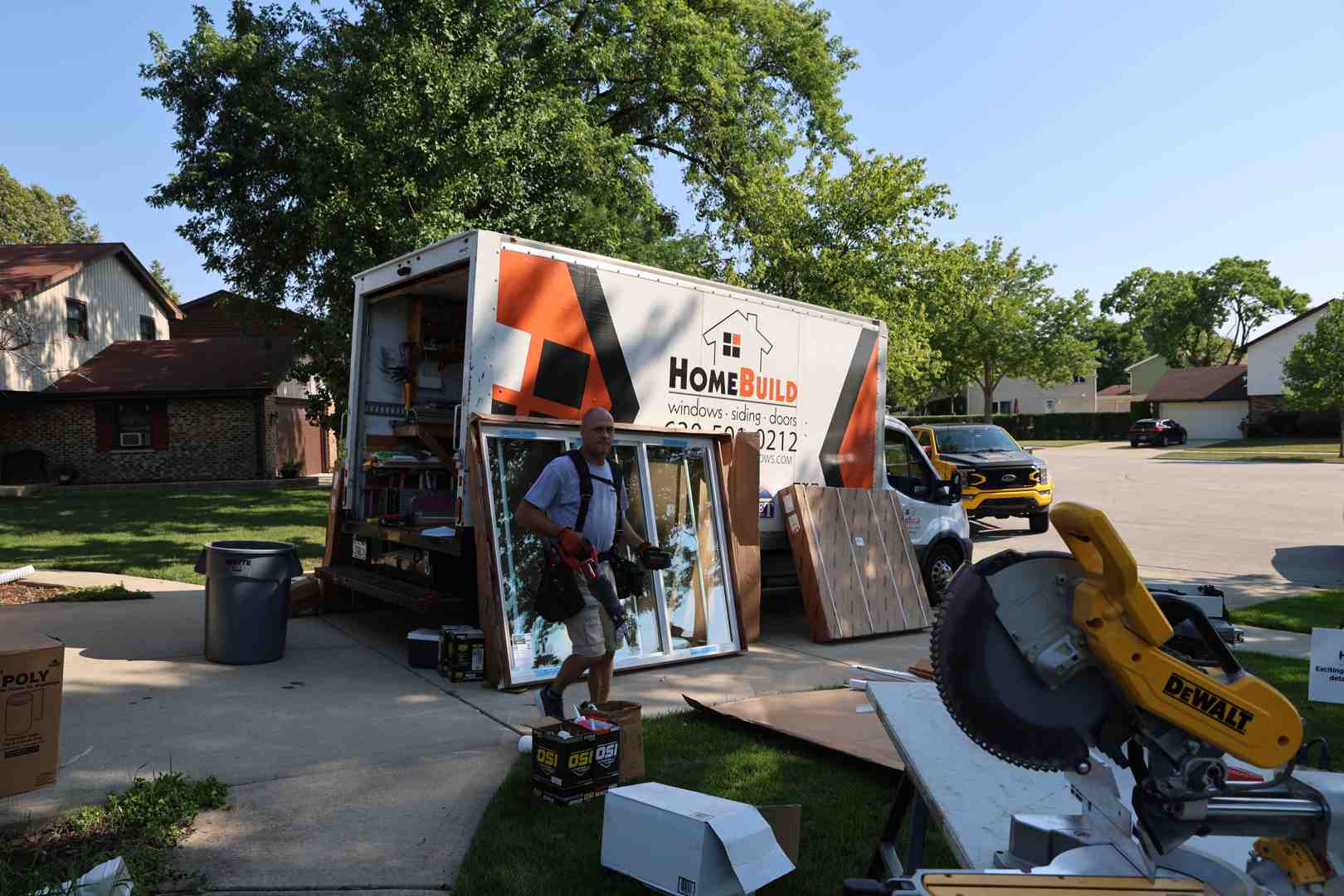 professional siding installers working on a residential home
