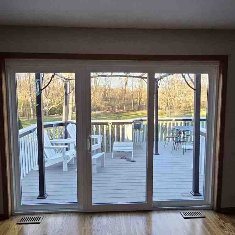 multi panel sliding glass door system installed on a modern backyard patio