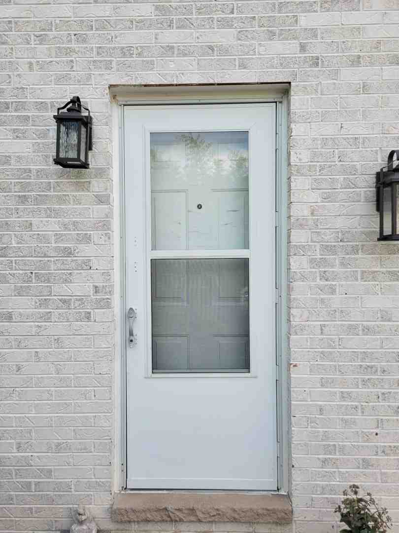 A durable storm door withstanding harsh wind and snow