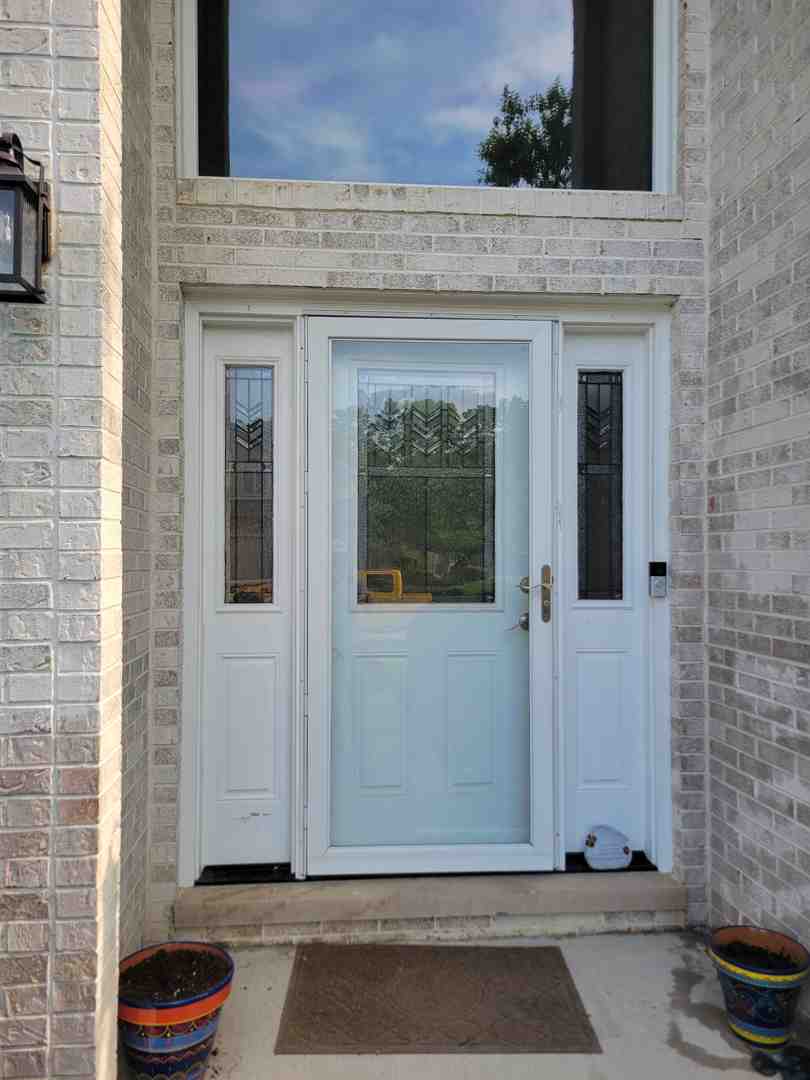 Double door with sidelites providing entry symmetry and a grand entrance