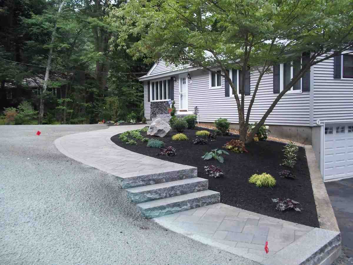 Attractive commercial landscape with professional mulch installation - Commercial mulch installation