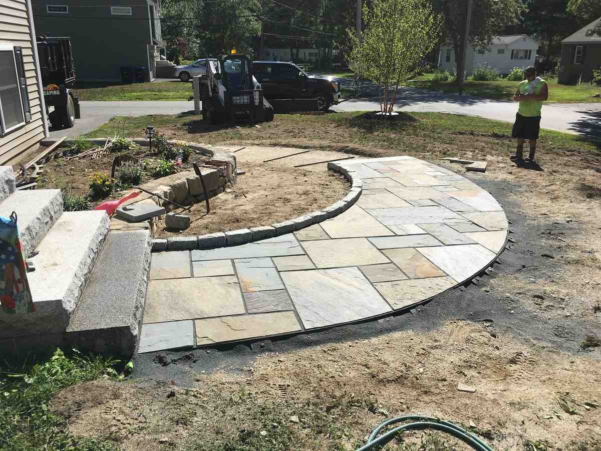 professional crew installing paver patio - Patio design Boxford MA