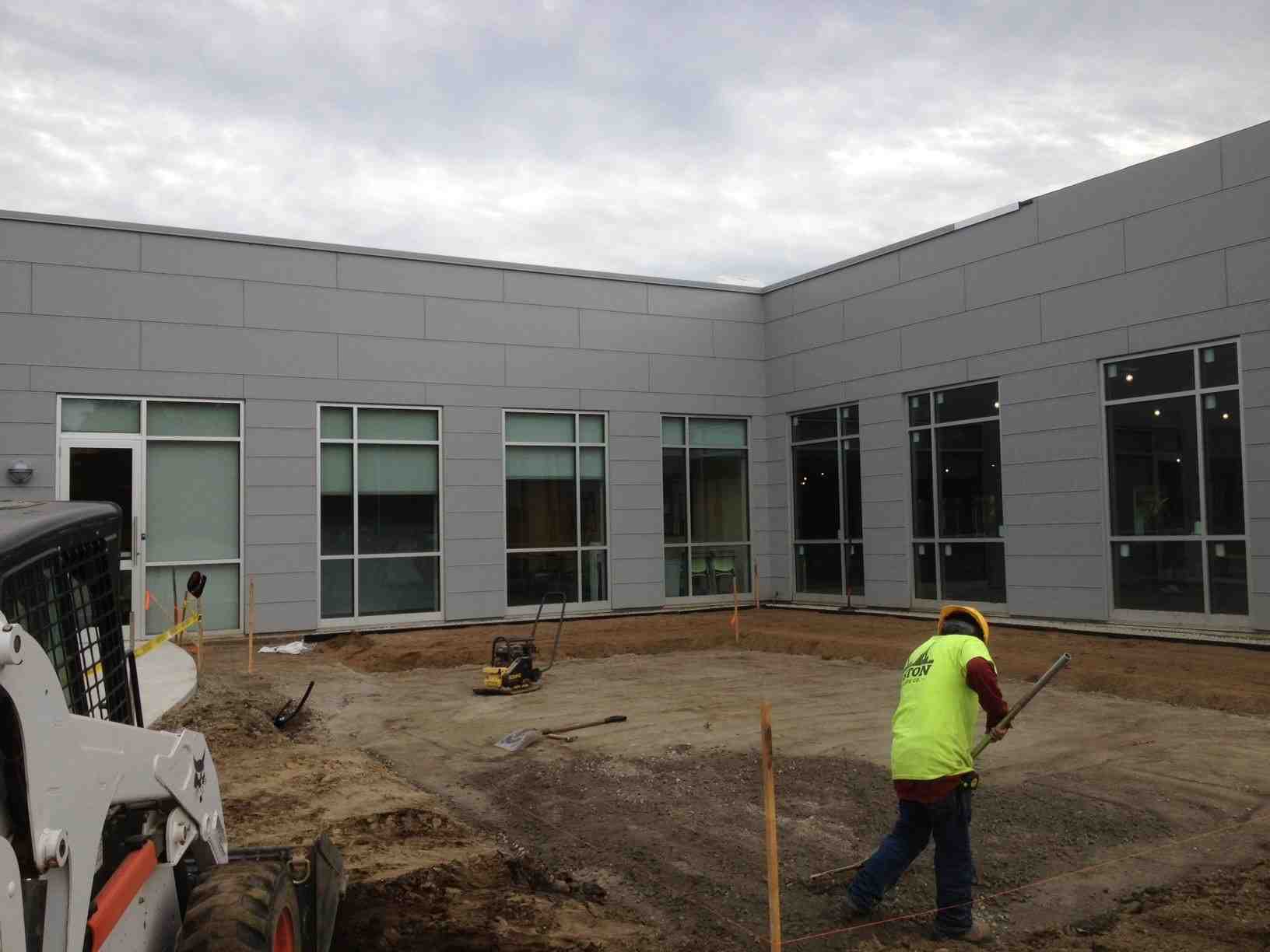 Excavating the area for a brick patio - Brick patio installation