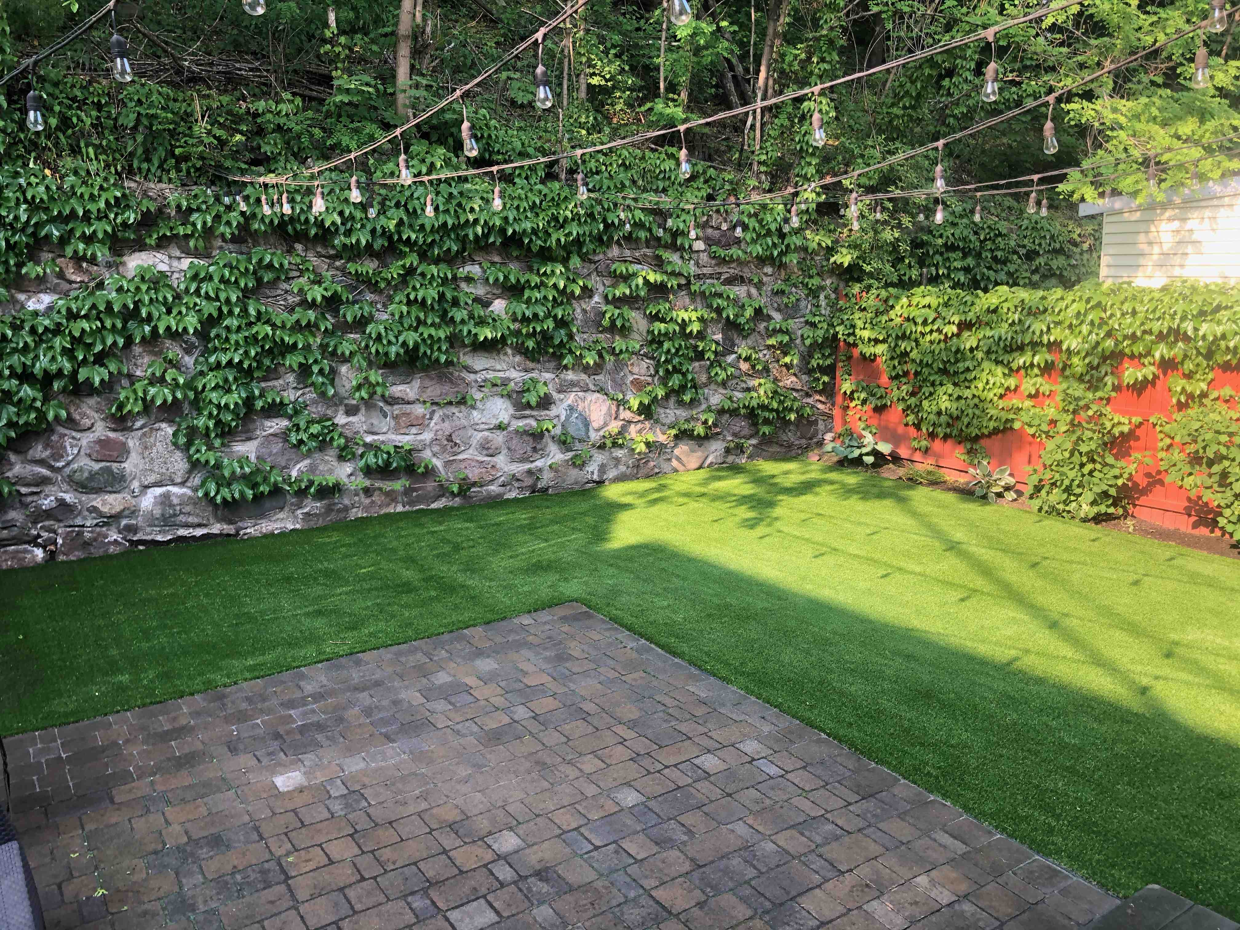 beautifully restored and sealed paver patio ready for summer enjoyment - hardscape repair near me