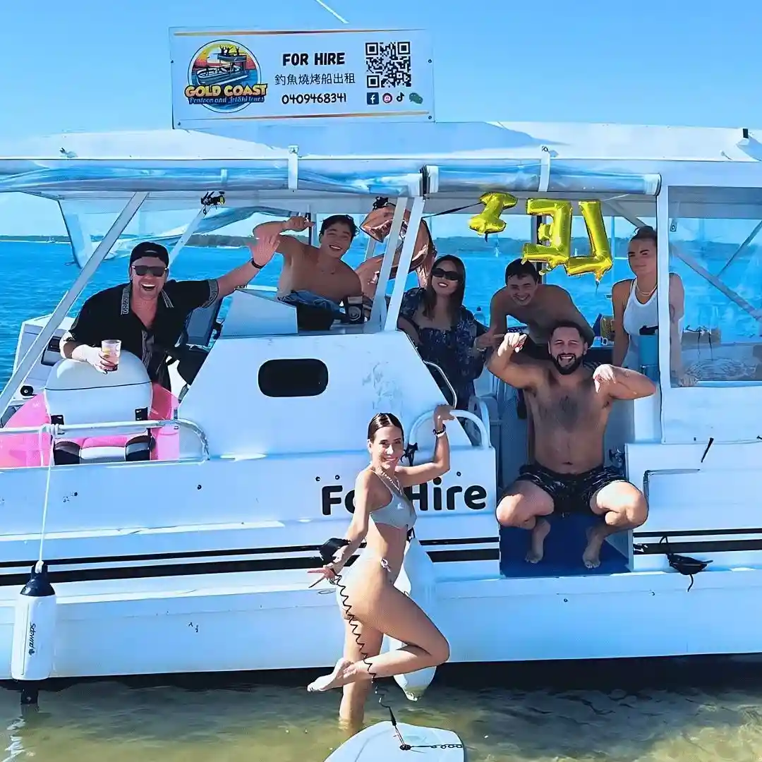 A spacious, modern pontoon boat with a group enjoying the sun, and a Sea-Doo jet ski nearby - barbeque boat hire gold coast A spacious, modern pontoon boat with a group enjoying the sun, and a Sea-Doo jet ski nearby - barbeque boat hire gold coast