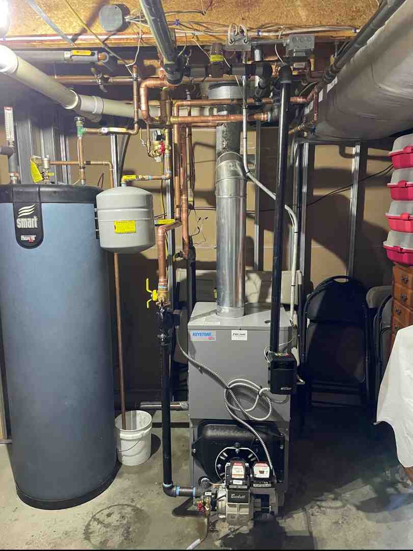 Water pooling under a residential boiler system