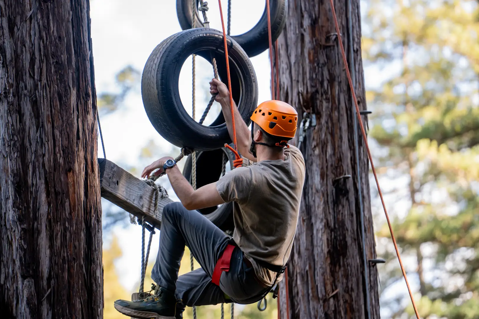 men engaging in outdoor challenge activities