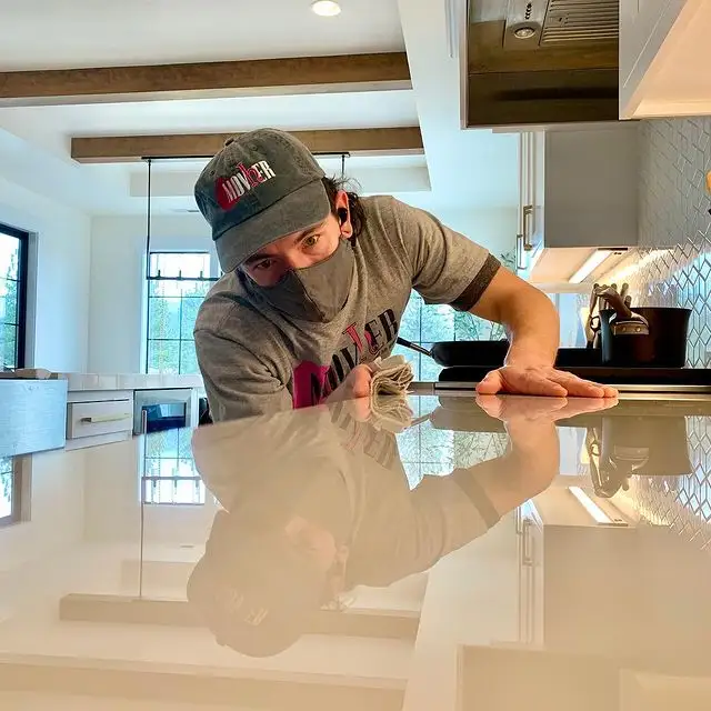 A clean, modern kitchen in Liberty Lake with sunlight reflecting off polished stone countertops - why regular cleaning is A clean, modern kitchen in Liberty Lake with sunlight reflecting off polished stone countertops - why regular cleaning is